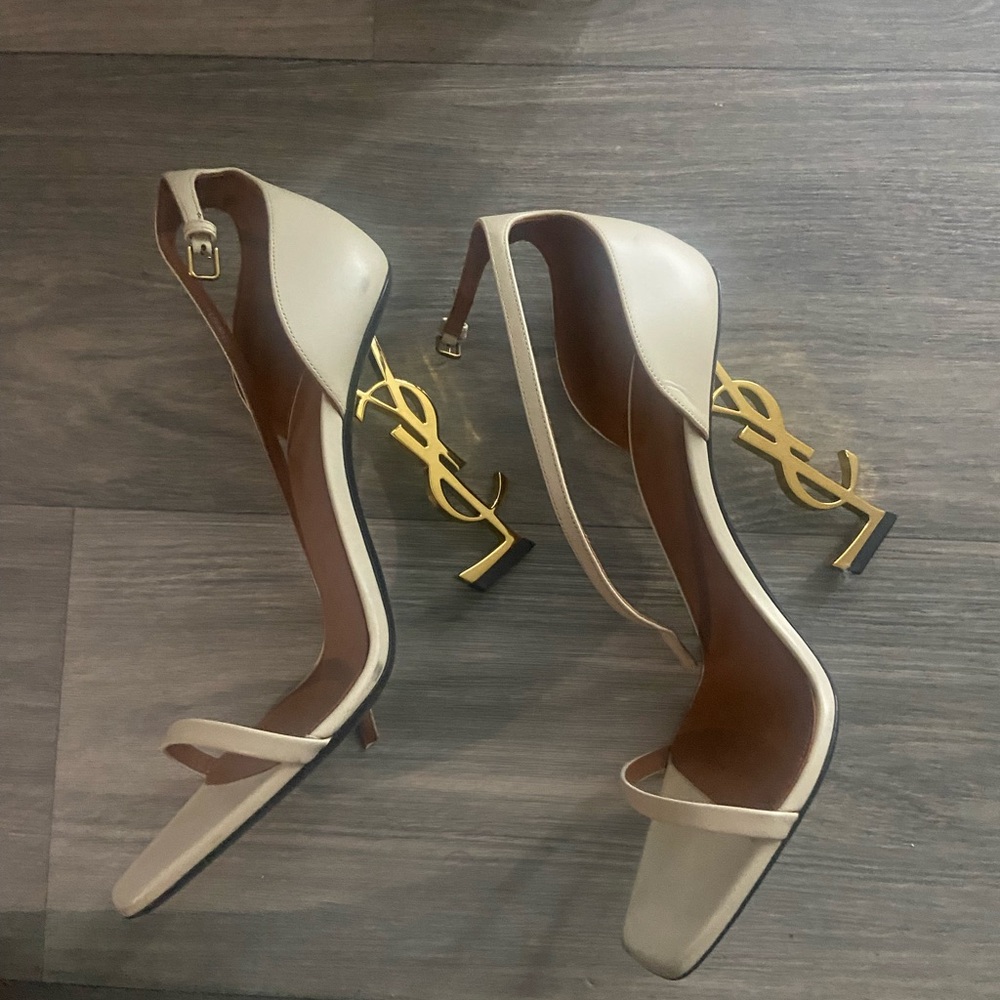 Yves Saint Laurent Elegant Cream Heels with Gold Accent